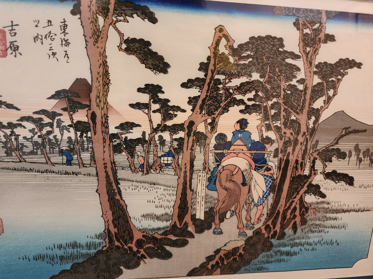 Japanese ukiyo-e woodblock print titled Yoshiwara: Mount Fuji on the Left by the artist Utagawa Hiroshige