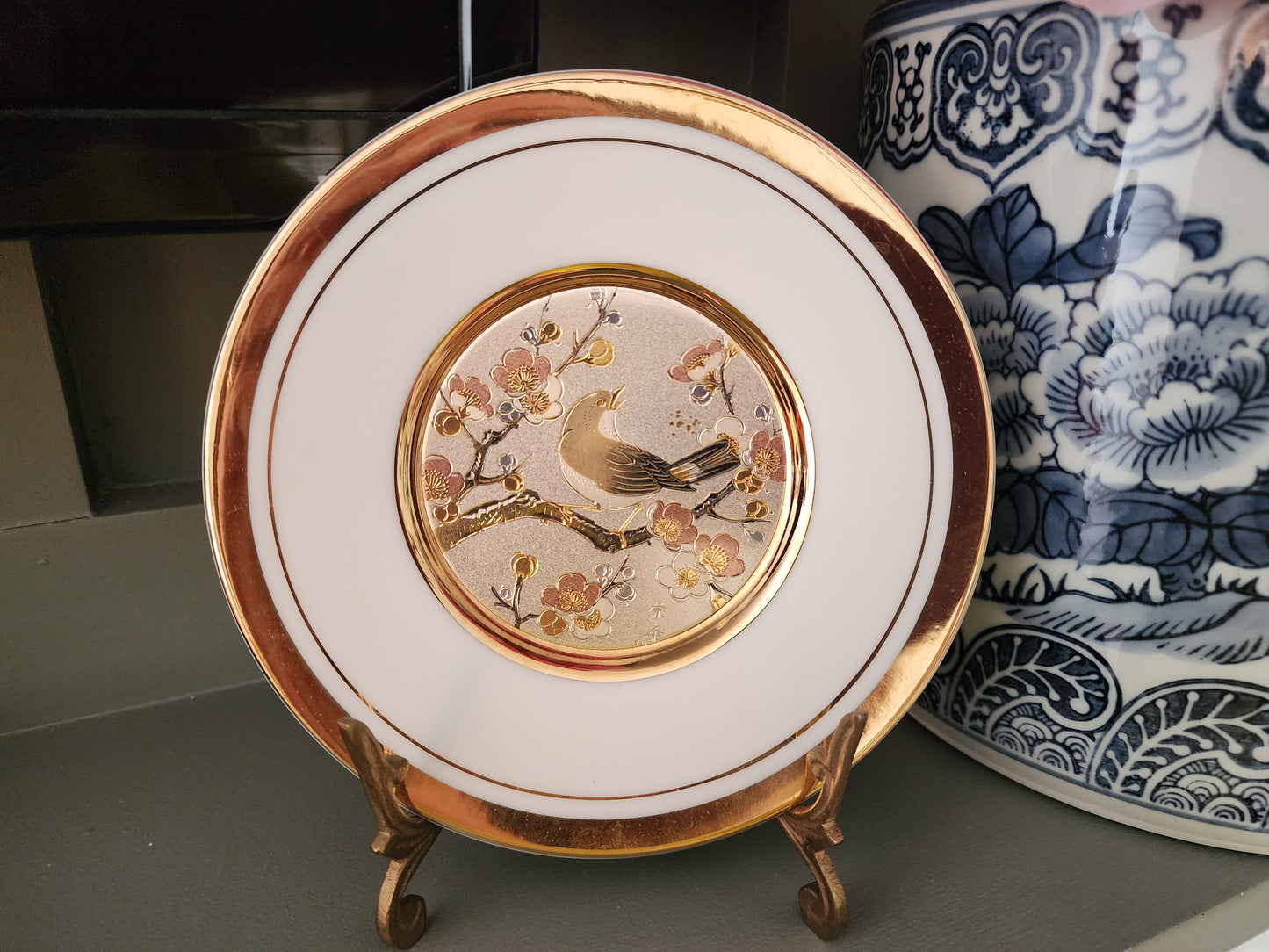 The Art of Chokin porcelain plate, featuring a detailed bird and cherry blossoms scene. 